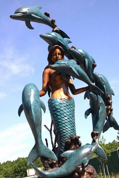 Mermaid with 8 Dolphins is a mesmerizing and enchanting sculpture